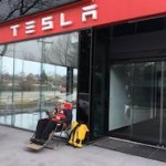 Man waiting for Tesla store to open in Toronto