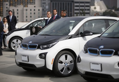 Mayor Eric Garcetti, stands with Petter Witt, Executive Vice President of Operations, BMW North America and LAPD Chief of Police Charlie Beck during a press conference about the Los Angeles Police Departments newly unveiled transportation fleet of 100 all-electric BMW i3 vehicles in Los Angeles, Calif. on June 8, 2016. Photo by Danny Moloshok/Newscast US